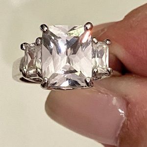 3 stone emerald cut ring